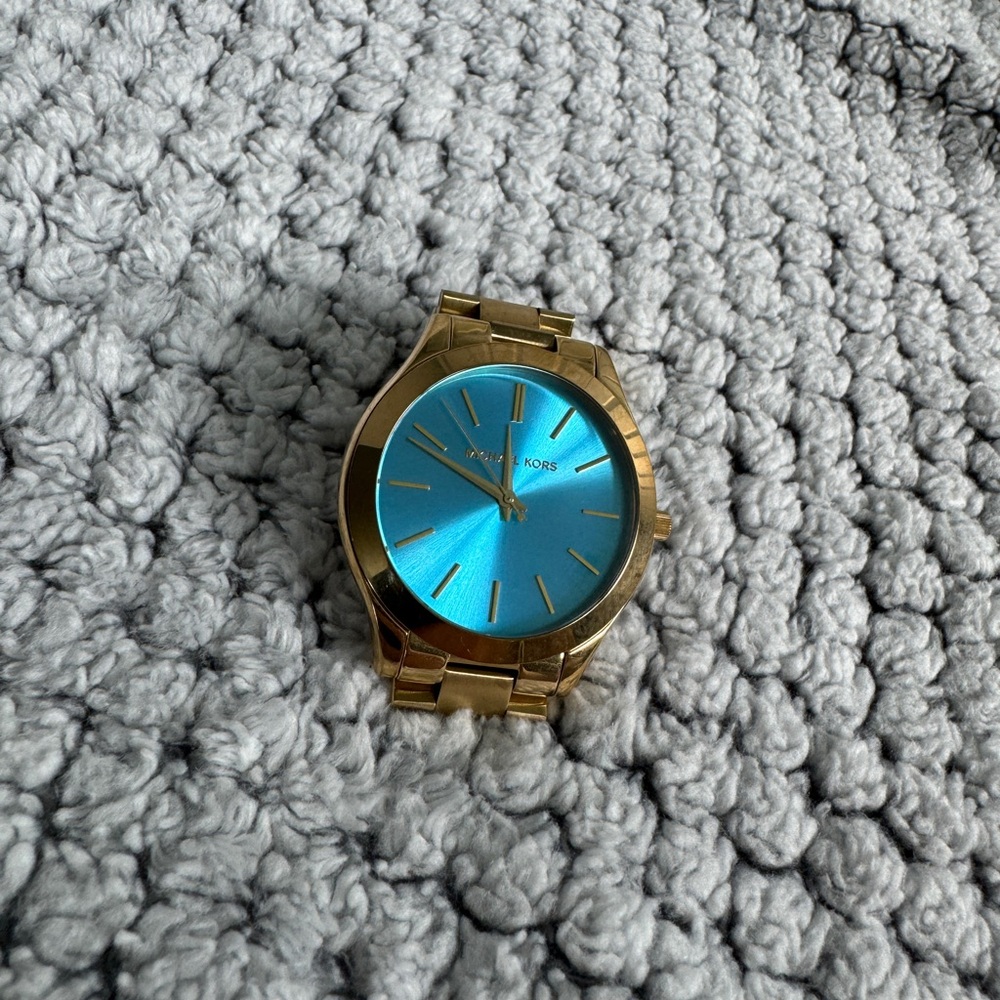Women’s gold/turquoise Michael Kors watch